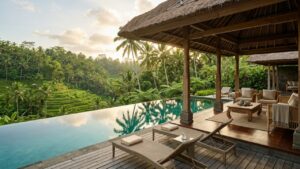 Bali luxury villa with teak open-air pavilion, infinity pool, and lush tropical landscape in warm afternoon light, illustrating why global investors are considering Bali as a lifestyle real estate destination.