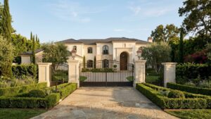 Refined Beverly Hills estate entrance with curated landscaping and clean architectural lines — luxury seller preparation and presentation 2026